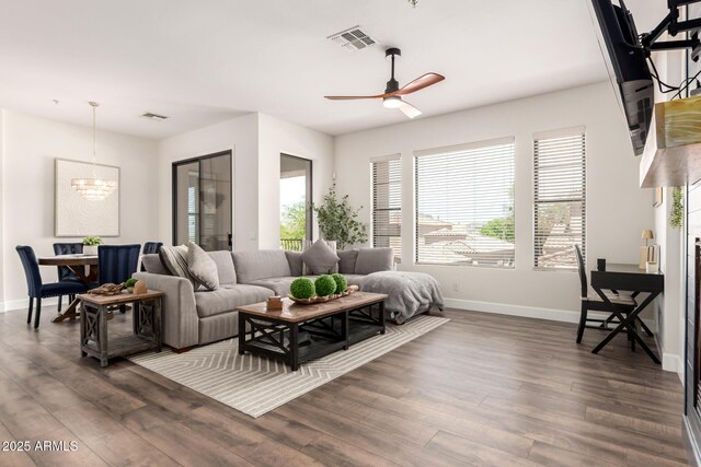 7445 E Eagle Crest Dr Unit 1145, Mesa, AZ 85207 - living area with visible vents, baseboards, and a wealth of natural light