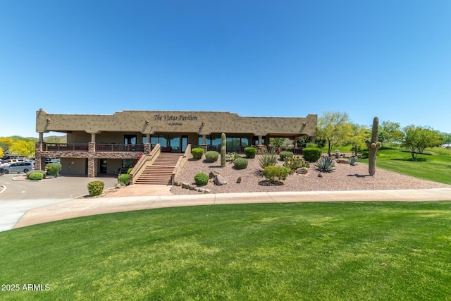 7445 E Eagle Crest Dr Unit 1145, Mesa, AZ 85207 - view of front of home with a front lawn and stairway