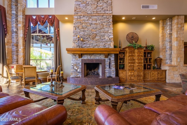 7445 E Eagle Crest Dr Unit 1145, Mesa, AZ 85207 - living room with a high ceiling, a fireplace, recessed lighting, and visible vents