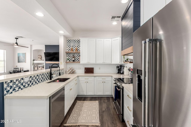 kitchen with ceiling fan, recessed lighting, light countertops, a sink, and appliances with stainless steel finishes