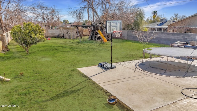 exterior space featuring a trampoline and a playground