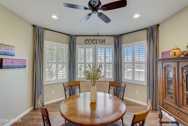 dining area with hardwood / wood-style floors, plenty of natural light, and ceiling fan