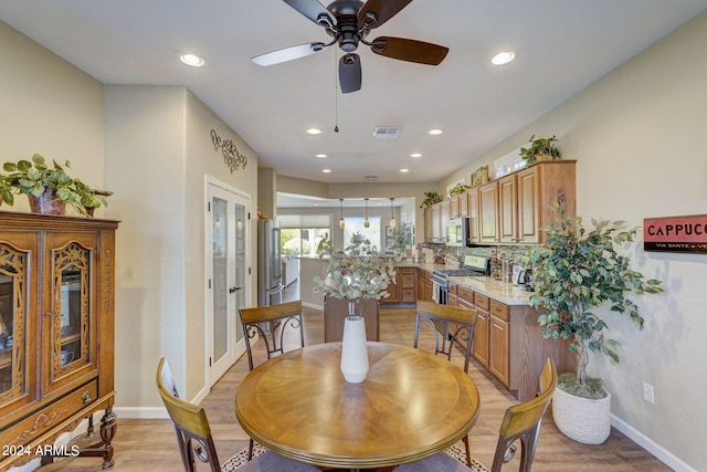 dining room featuring ceiling fan and light hardwood / wood-style floors