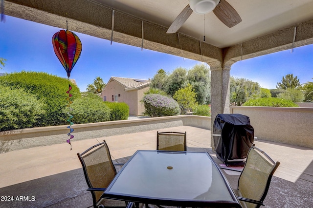 view of patio featuring a grill and ceiling fan