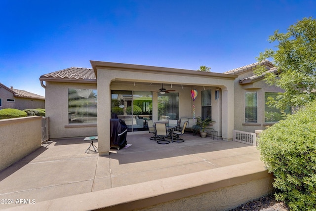 back of house featuring ceiling fan and a patio area