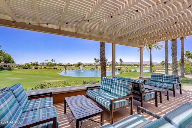 view of patio with a pergola, outdoor lounge area, and a water view