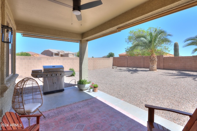 view of patio / terrace featuring ceiling fan and grilling area