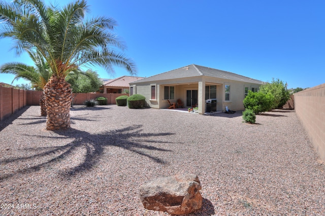 back of property with a patio area