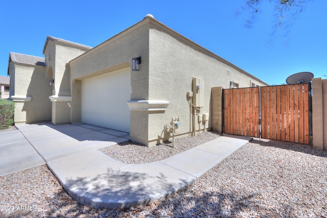 view of property exterior with a garage