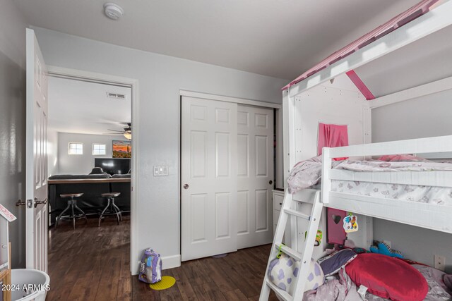 bedroom with dark wood-type flooring