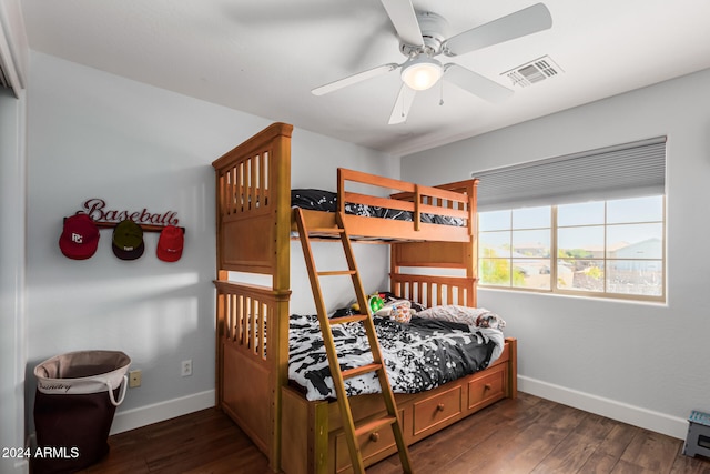 bedroom with ceiling fan and dark hardwood / wood-style floors