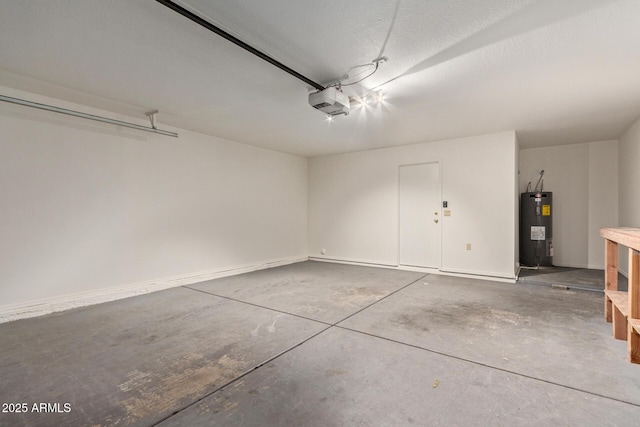 garage featuring a garage door opener and electric water heater