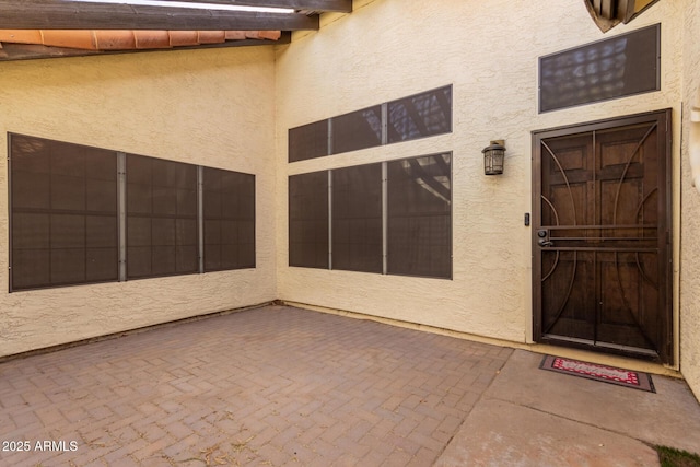 doorway to property featuring a patio