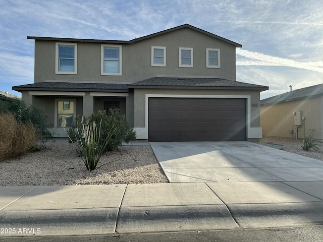 view of front of property with a garage