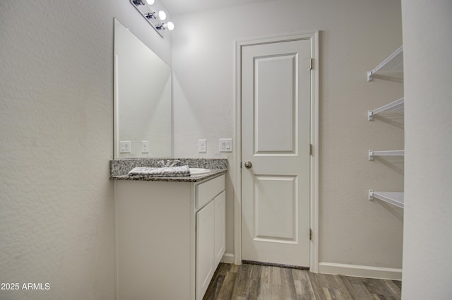 bathroom featuring wood-type flooring and vanity