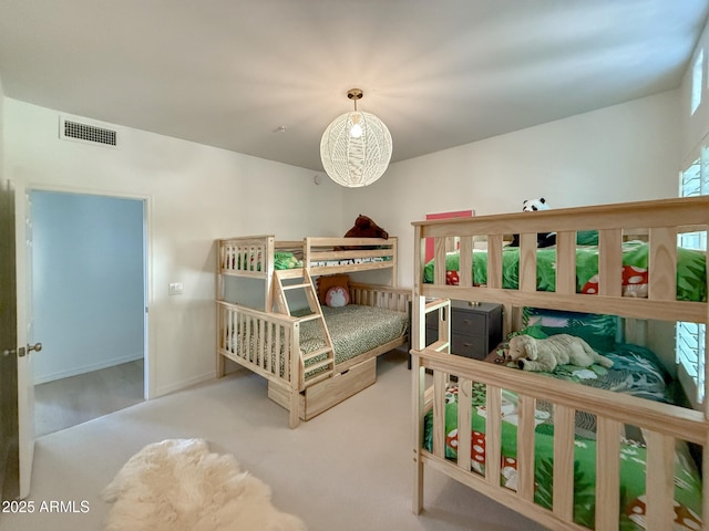 bedroom with visible vents, baseboards, and carpet