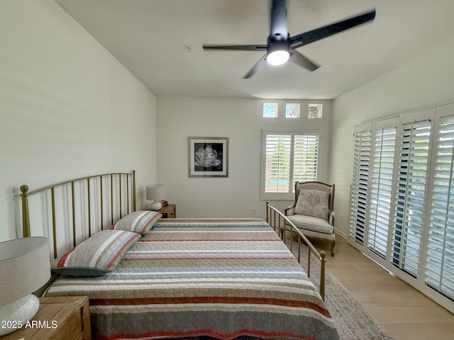 bedroom with light wood-style floors and a ceiling fan