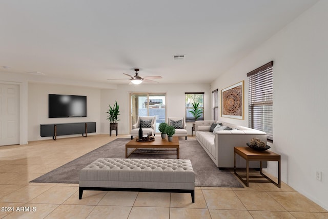 living room with light tile patterned floors and a ceiling fan
