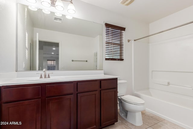 full bath featuring tile patterned flooring, toilet, vanity, and shower / bath combination