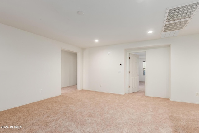 unfurnished room featuring light carpet and recessed lighting