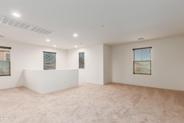empty room featuring carpet floors and recessed lighting