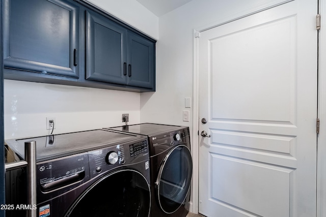 clothes washing area with independent washer and dryer and cabinets