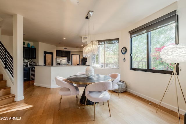 dining room with light hardwood / wood-style flooring