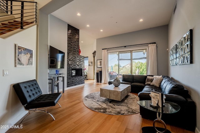 living room featuring a fireplace and light hardwood / wood-style floors