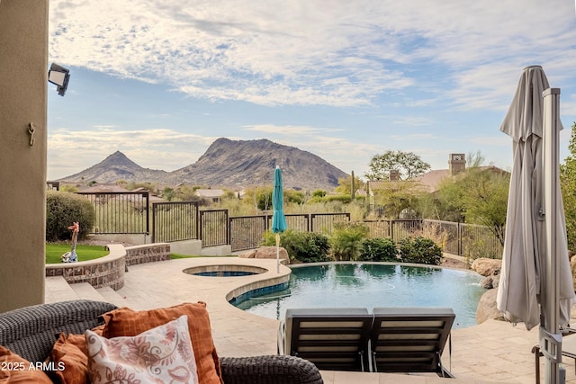 view of swimming pool with a mountain view, an in ground hot tub, and a patio