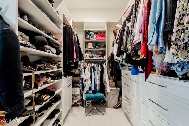 spacious closet featuring light tile patterned flooring