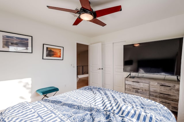 bedroom with ceiling fan and a closet