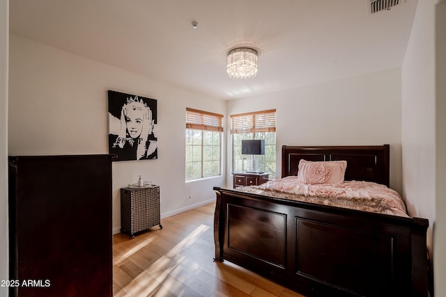 bedroom featuring light hardwood / wood-style floors