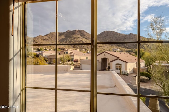 entryway featuring a mountain view and a healthy amount of sunlight