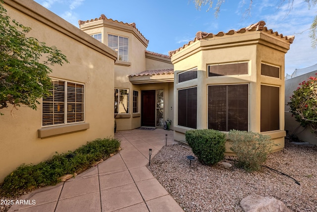 entrance to property with a patio area