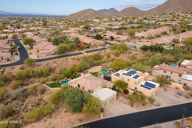 birds eye view of property with a mountain view