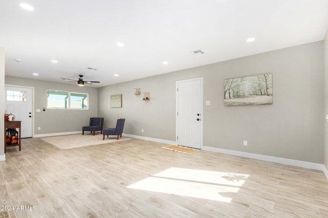 unfurnished room featuring ceiling fan and light hardwood / wood-style floors