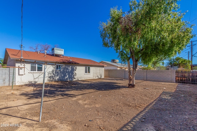 rear view of property featuring a patio area