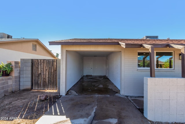 exterior space with a carport