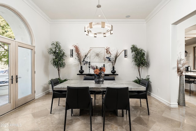 dining space featuring ornamental molding and french doors