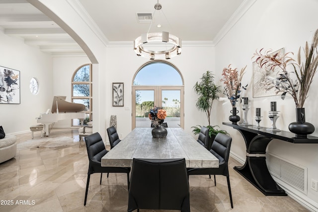 dining space featuring french doors, beamed ceiling, ornamental molding, and a notable chandelier