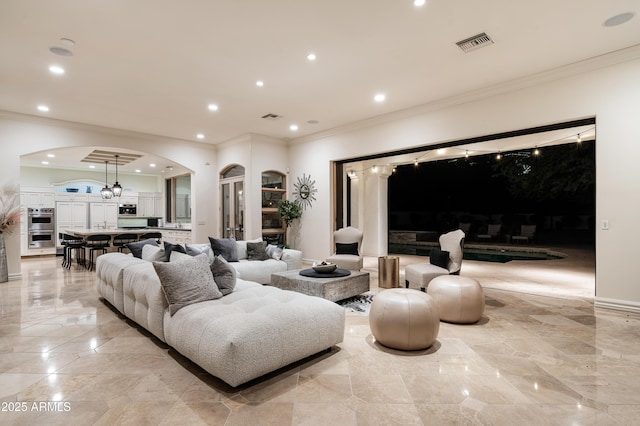 living room featuring crown molding