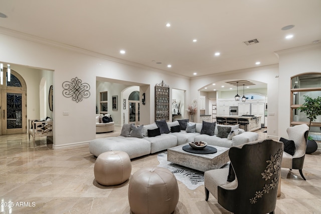 living room featuring crown molding