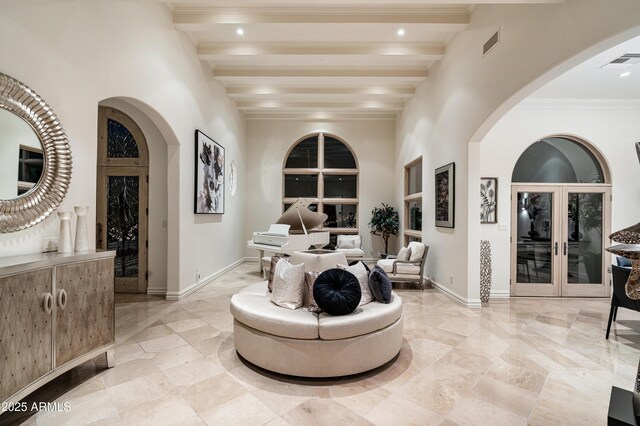 interior space featuring french doors and beamed ceiling