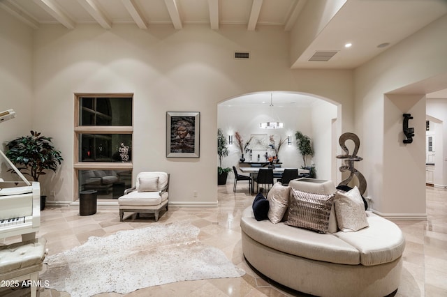 living room with beamed ceiling