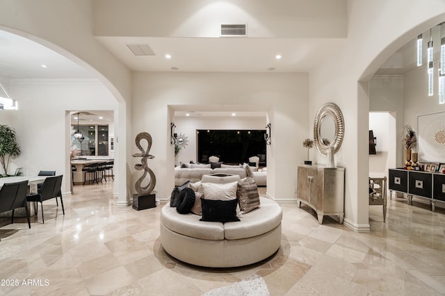 living room featuring crown molding