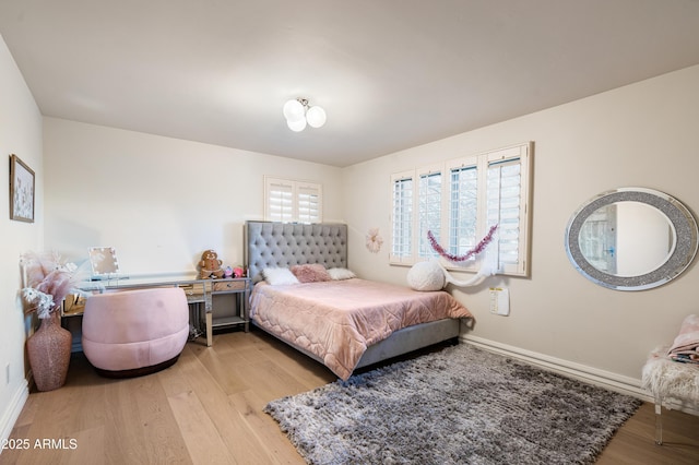 bedroom featuring light wood-type flooring