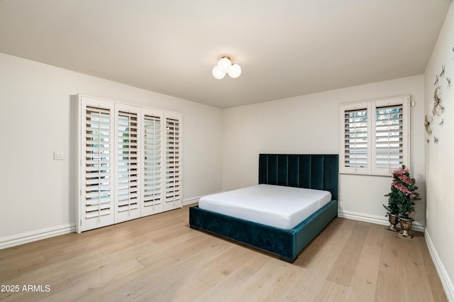 bedroom with hardwood / wood-style flooring