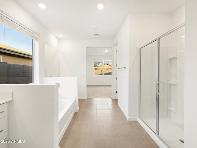 bathroom with recessed lighting, a shower stall, vanity, and tile patterned floors