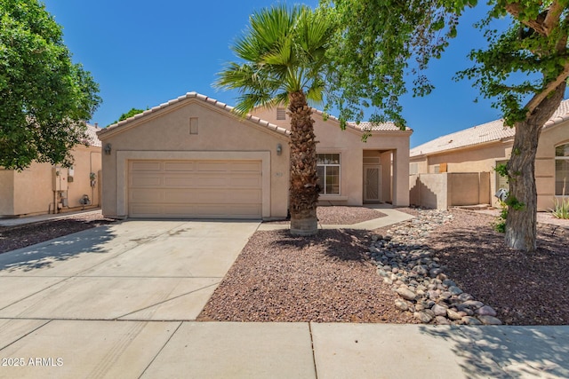 2922 N 107th Dr, Avondale, AZ 85392 - view of front of house featuring a tile roof, stucco siding, an attached garage, fence, and driveway
