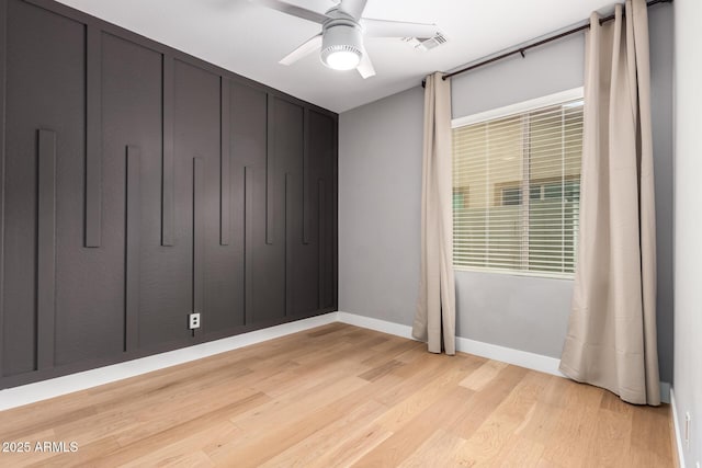 unfurnished bedroom featuring light wood-type flooring, baseboards, visible vents, and ceiling fan